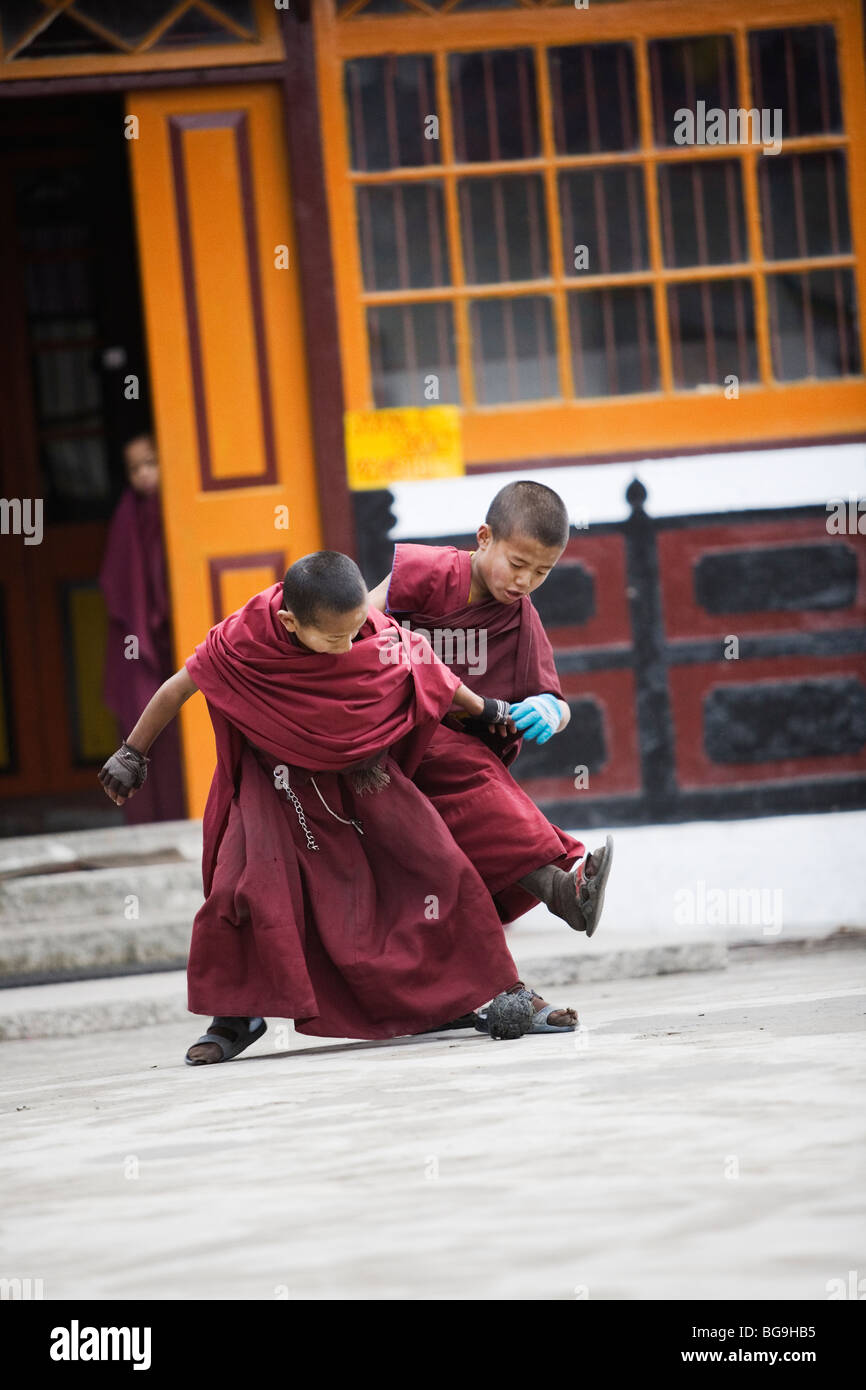 Young novice monks playing football at Ghoom monastery near Darjeeling, India Stock Photo