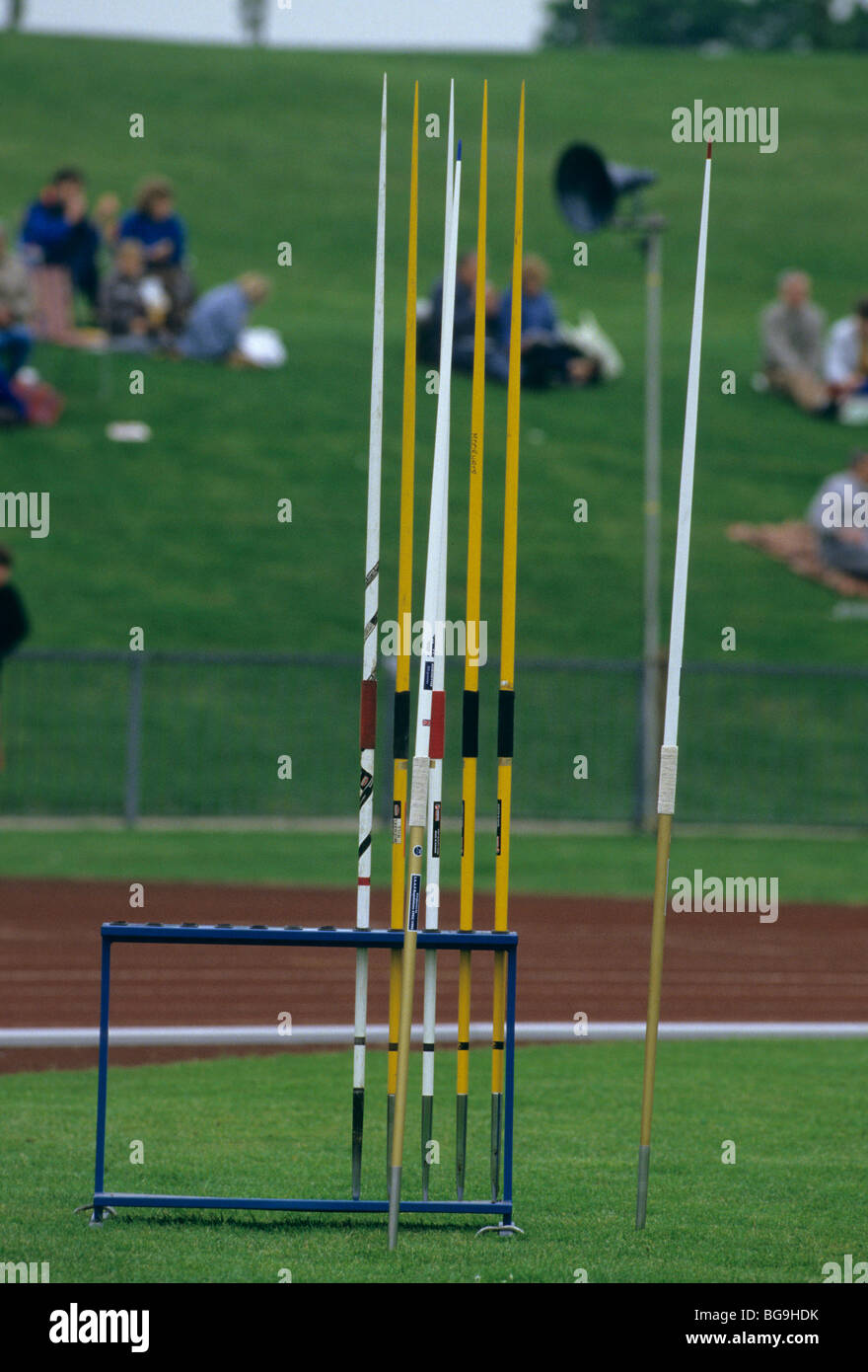 Rack of javelins with spectators in background Stock Photo Alamy