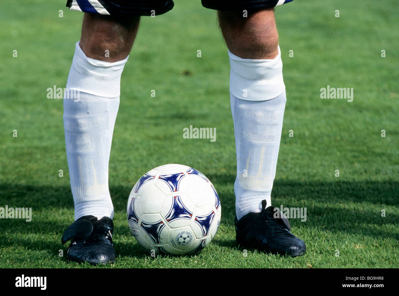 Football player with a ball at his feet Stock Photo Alamy