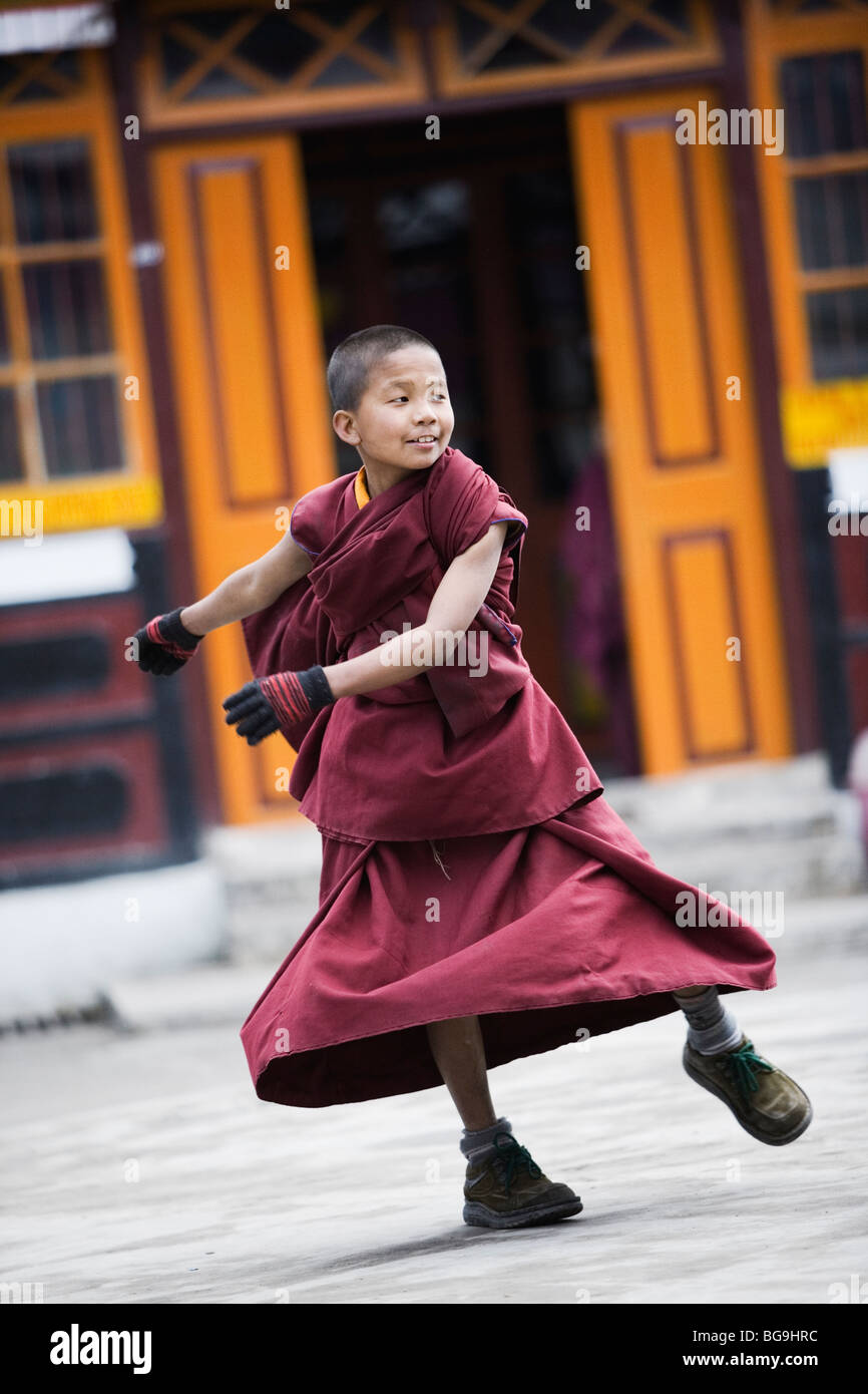 Young novice monk playing at Ghoom monastery near Darjeeling, India Stock Photo