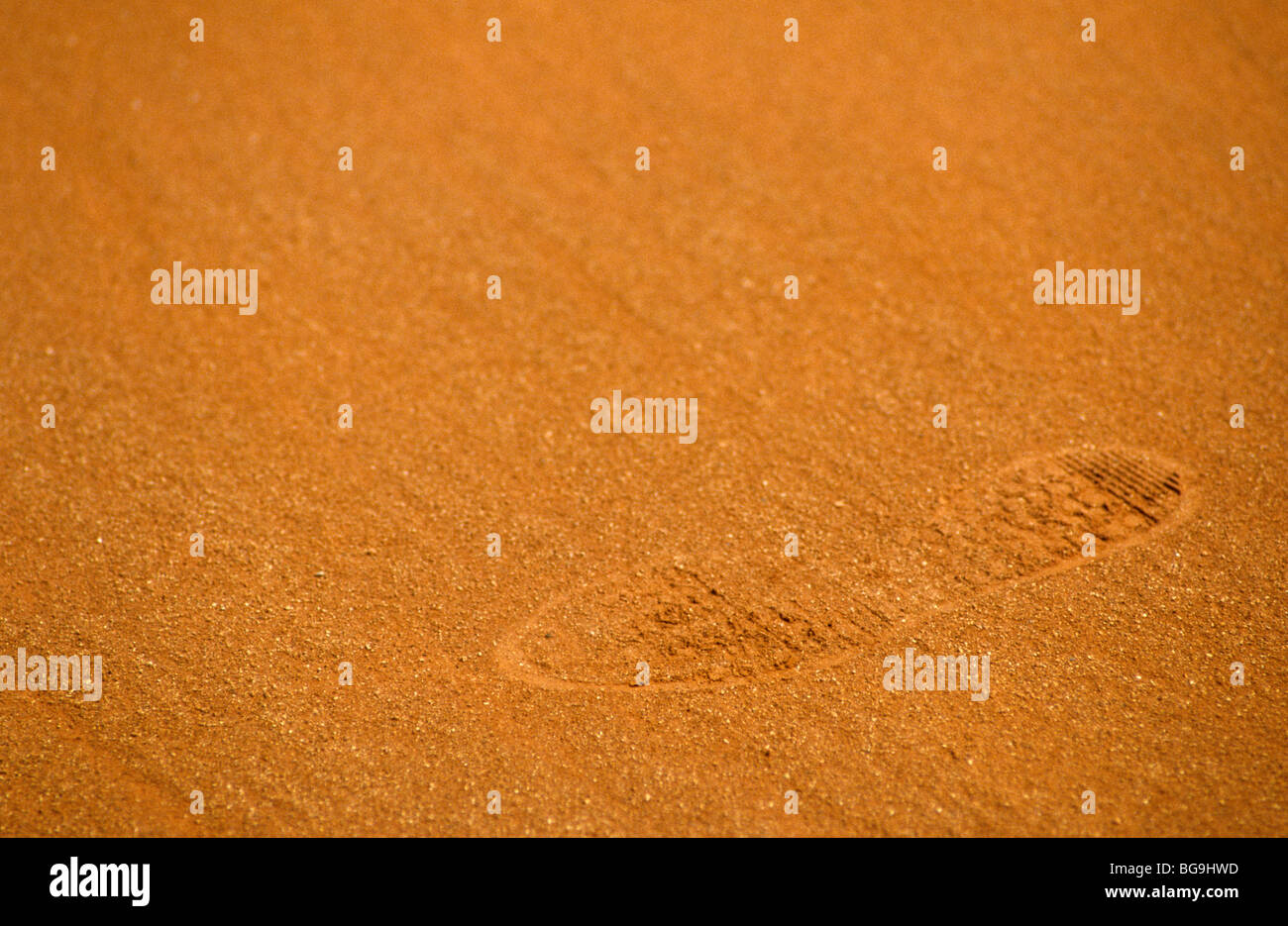 Tennis shoe imprint on a clay court Stock Photo