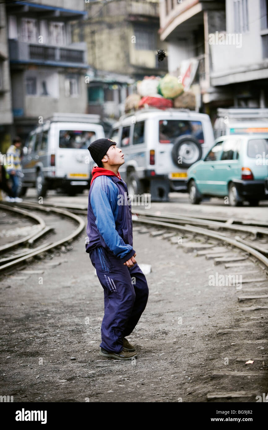 Young man playing footbag in Ghoom near Darjeeling, India Stock Photo