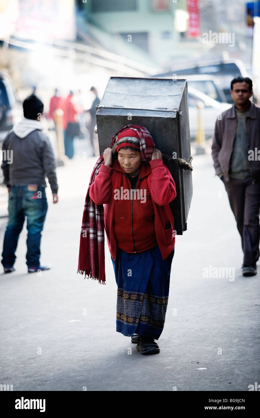 Woman carrying a load in Darjeeling, India Stock Photo