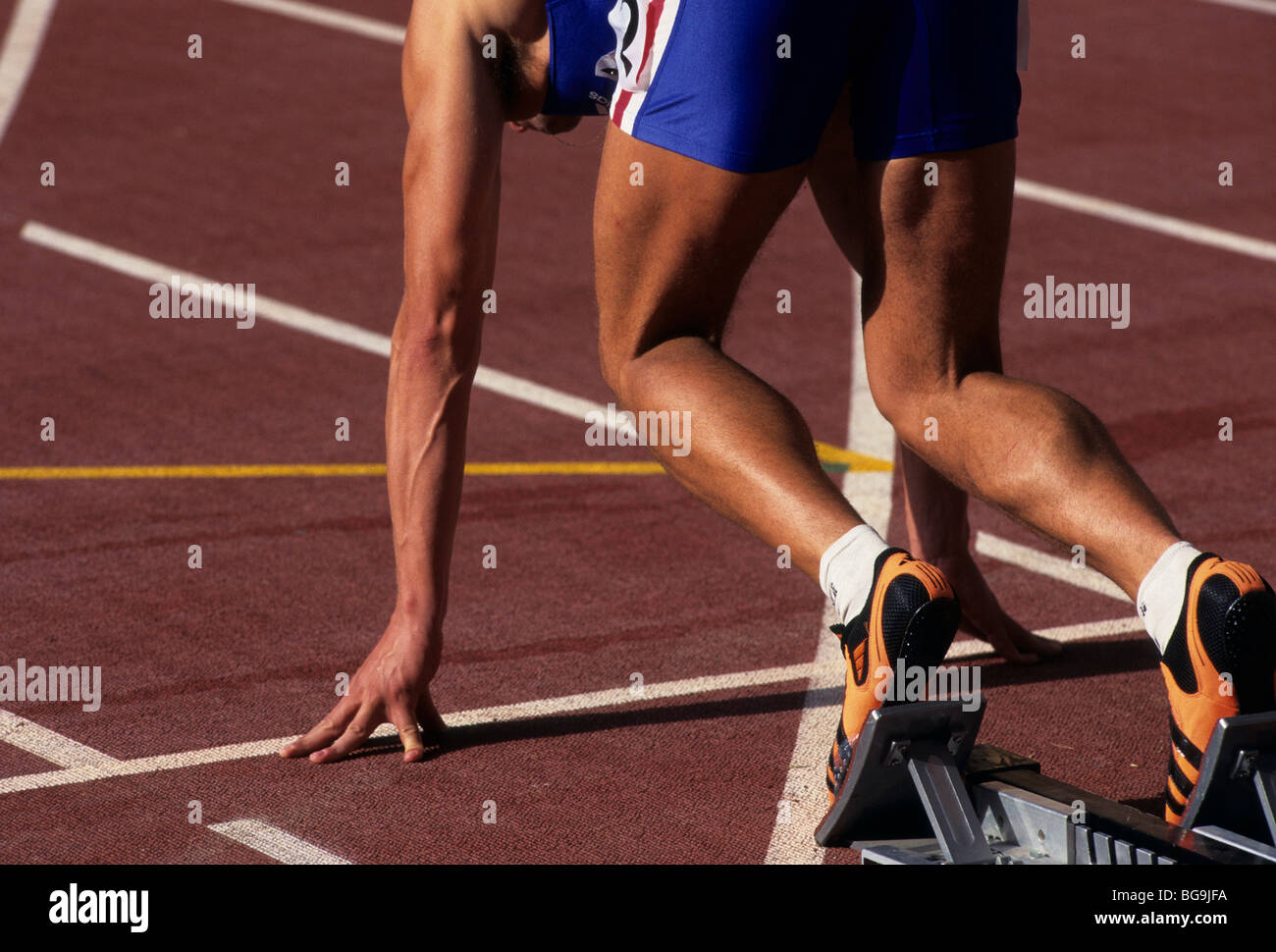Sprinter in the starting block Stock Photo Alamy