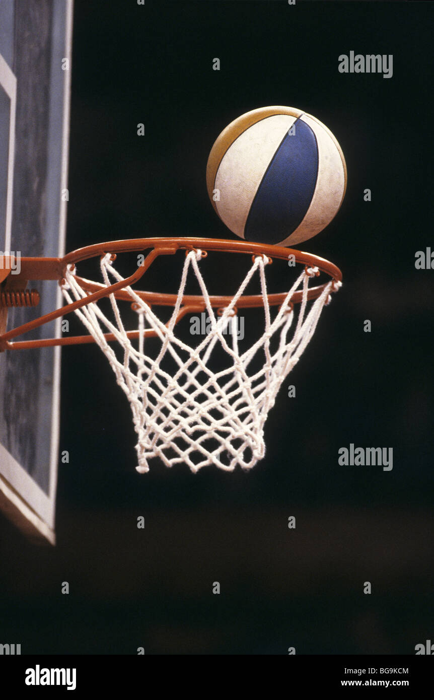 Basketball on the edge of the hoop Stock Photo Alamy