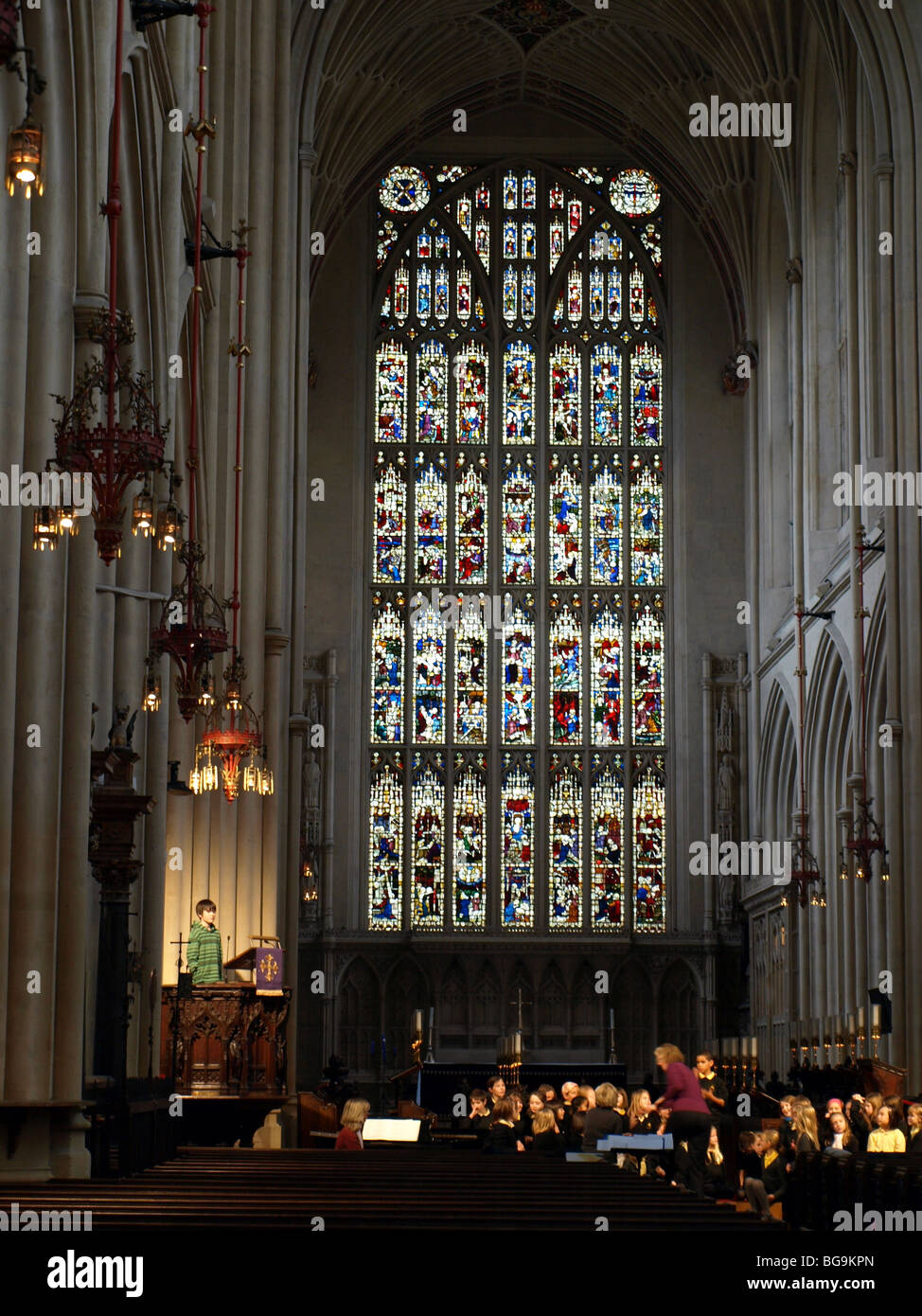 Schoolchildren rehearsing Christmas carols in Bath Abbey with the great