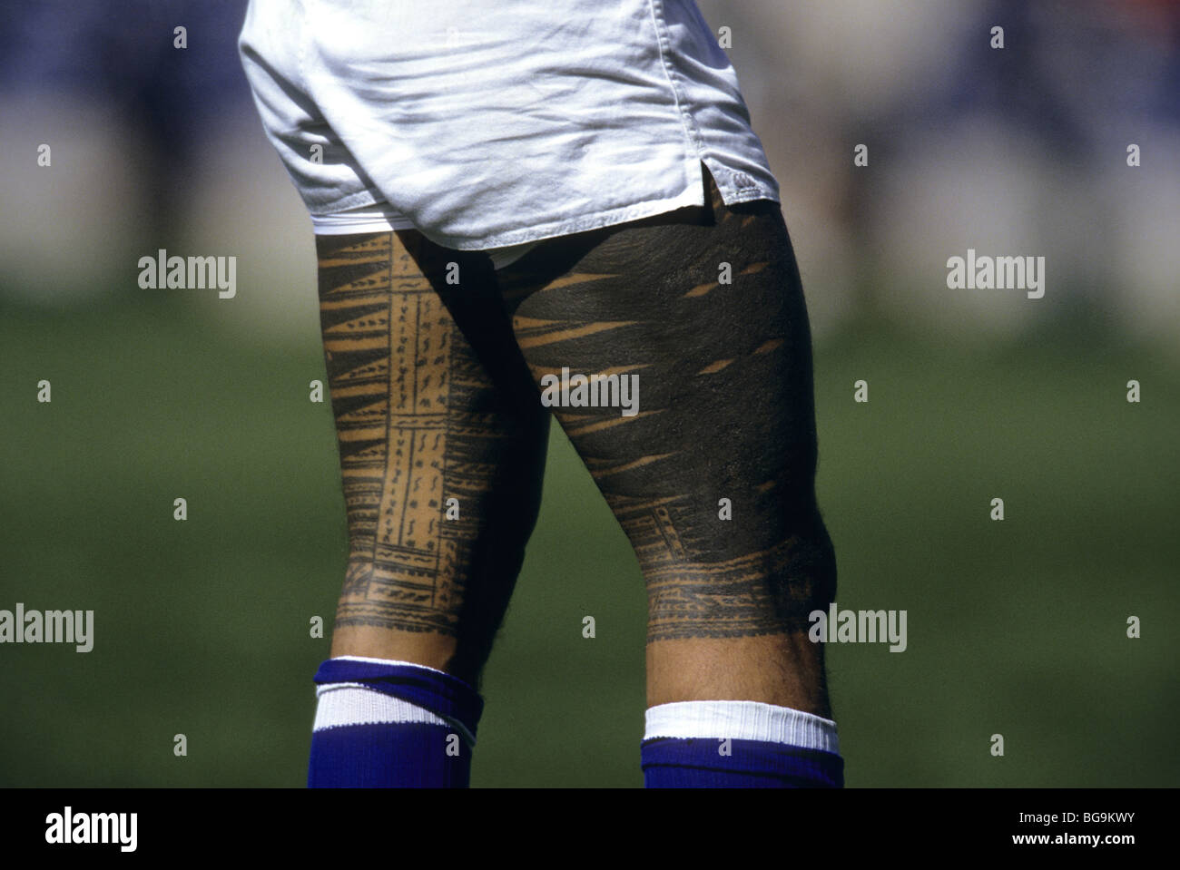Tattoos on legs of a rugby player Stock Photo Alamy