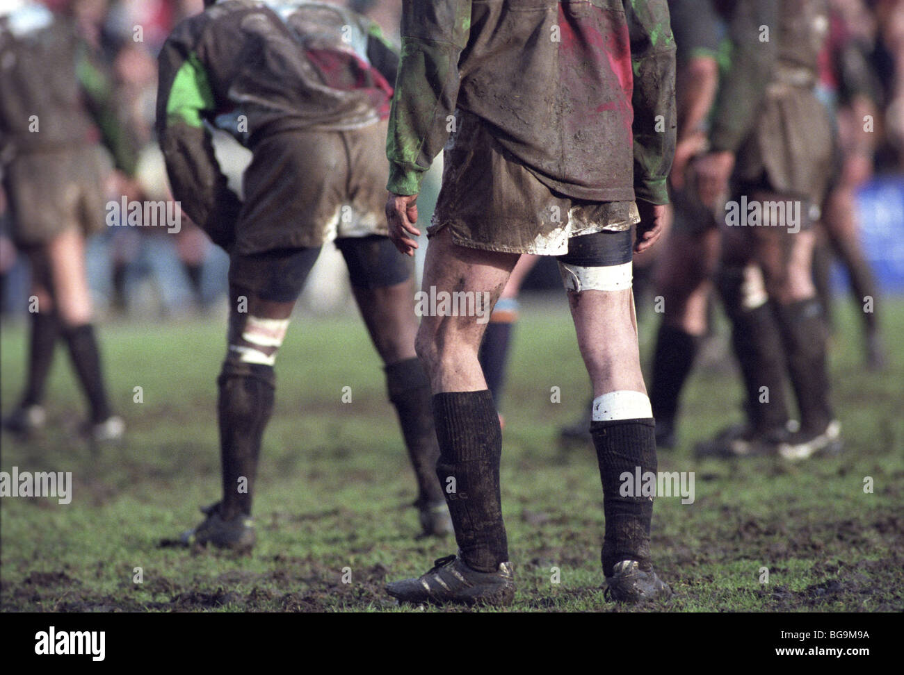 Mud covered rugby players Stock Photo