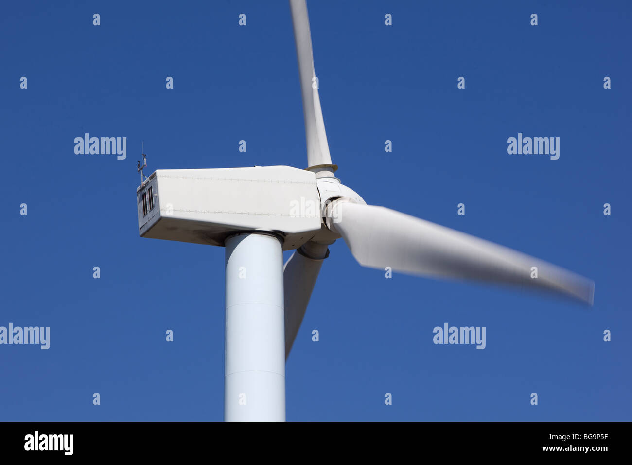 wind turbines renewable power over a blue sky Stock Photo