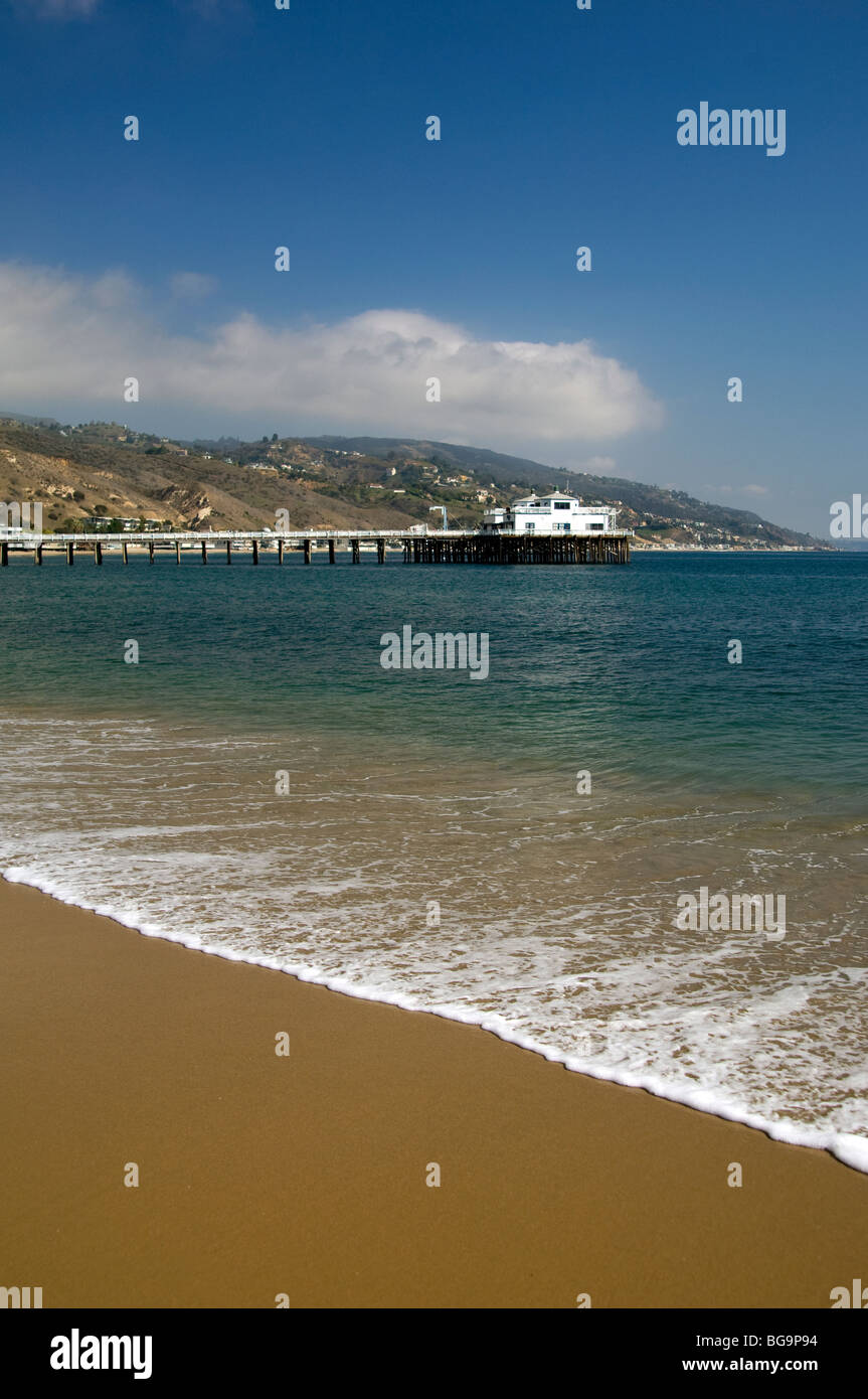 View from Malibu Beach of the pier and hills of the Southern California Coastline Stock Photo