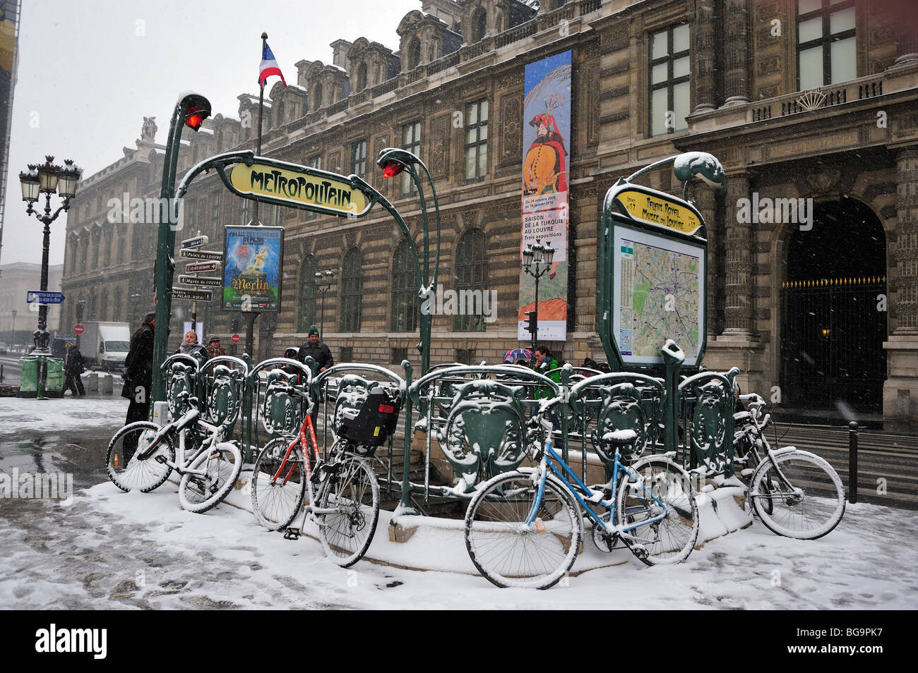 Paris, France, Street Scene, Snow Storm, Rue de Rivoli, Palais Royale Metro Station Entrance, and Louvre Museum Building, Bicycles, winter signs Stock Photo