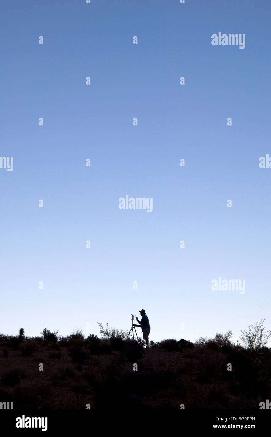 Man painting outdoors Stock Photo