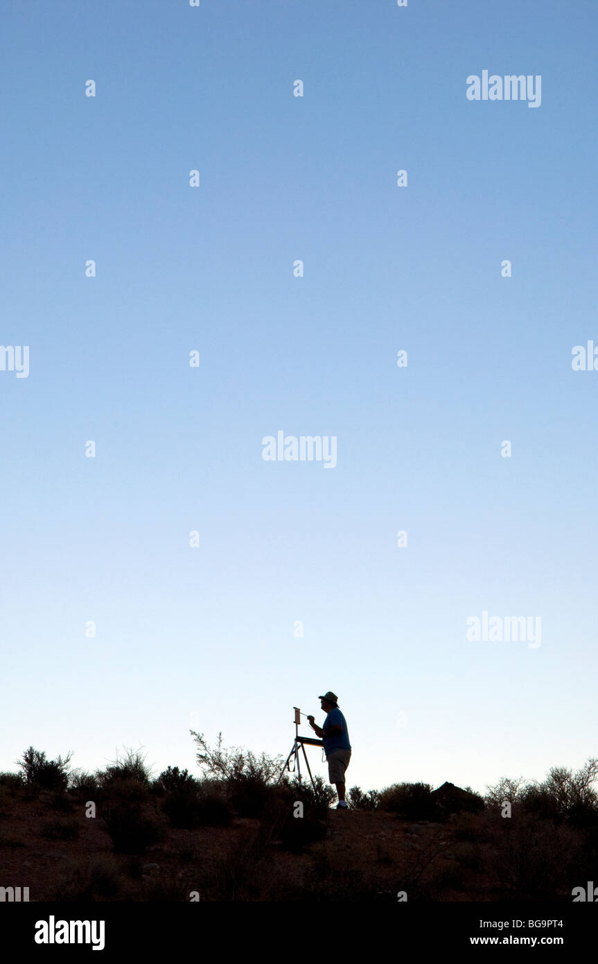 Man Painting Outdoors Stock Photo