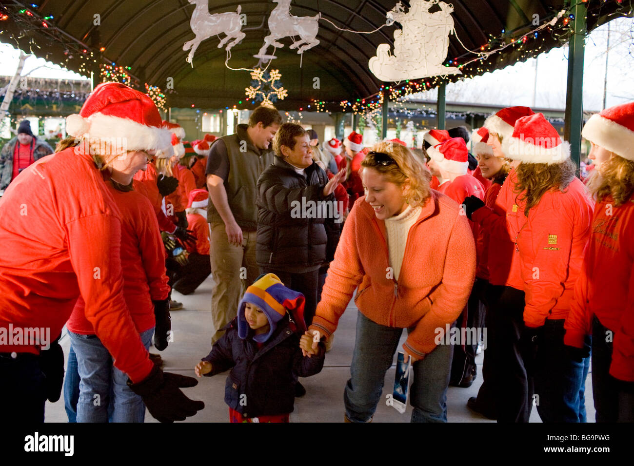 Santa's Elves greet children, Polar Express train ride and story time, Burlington, Vermont Stock Photo