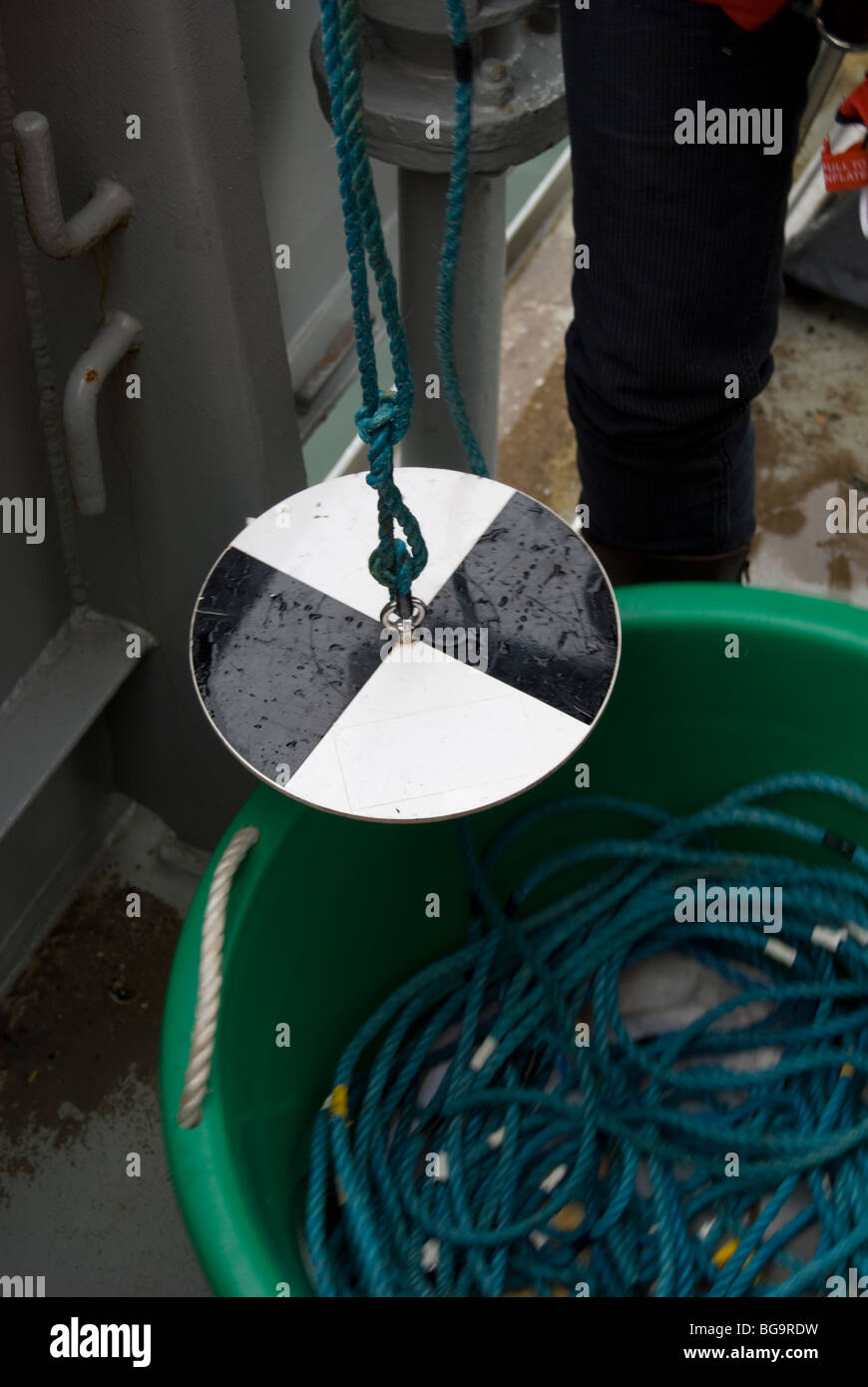 Researcher showing equipment to measure water turbity, Ireland Stock