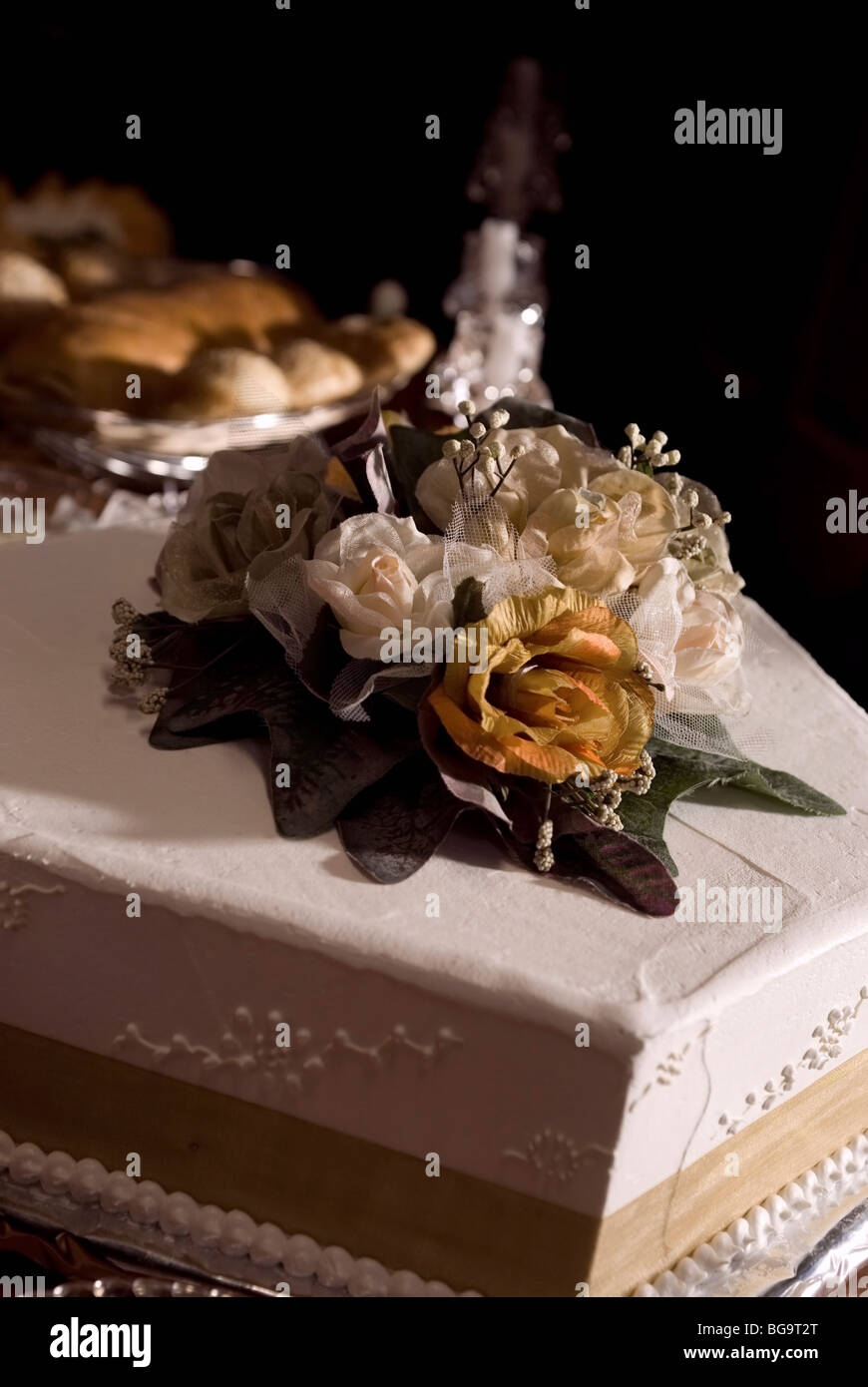 White iced cake with flower on the top Stock Photo