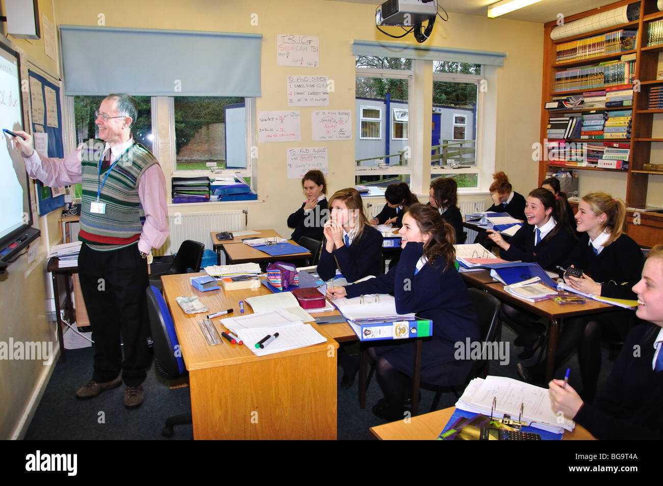 Male teacher teaching girls in classroom, Heathfield St.Mary's School, London Road, Ascot, Berkshire, England, United Kingdom Stock Photo