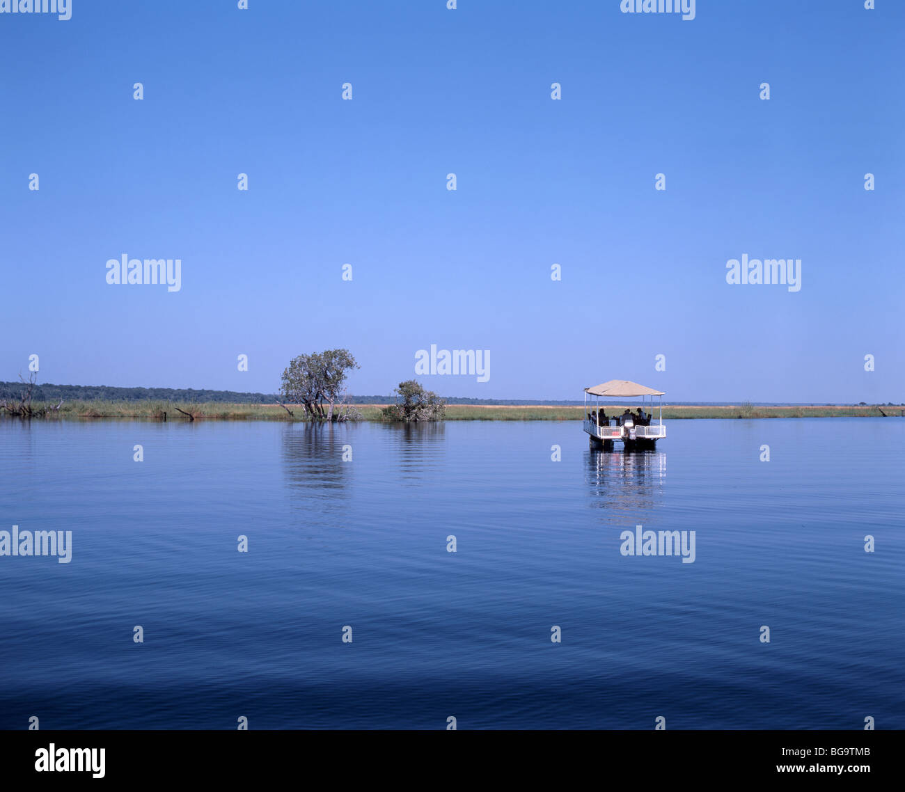 Safari boat on River Chobe, Chobe National Park, Botswana Stock Photo