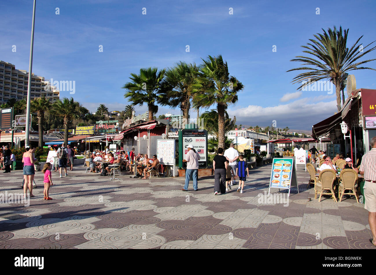 Outdoor cafes on beach promenade, Playa del Ingles, San Bartolome de Tirajana Municipality Gran Canaria, Canary Islands, Spain Stock Photo