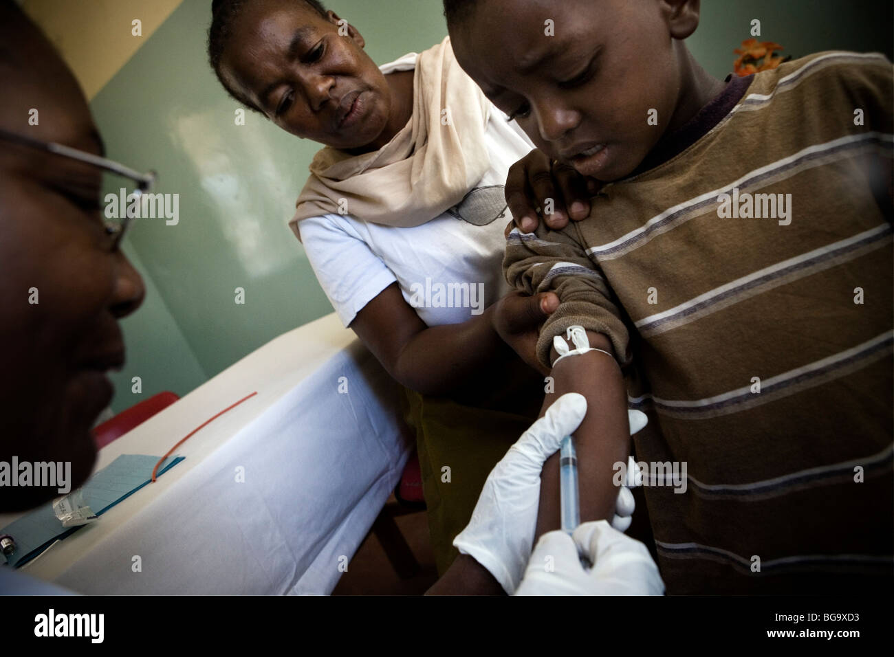 A child receives an HIV test in a clinic funded by the Global Fund and PEPFAR, Mererani, Tanzania, East Africa. Stock Photo