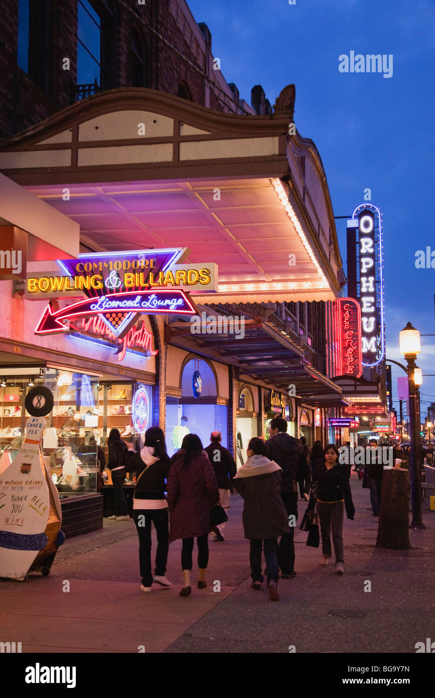 Neon signs and pedestrians bring life to Granville Mall between Robson