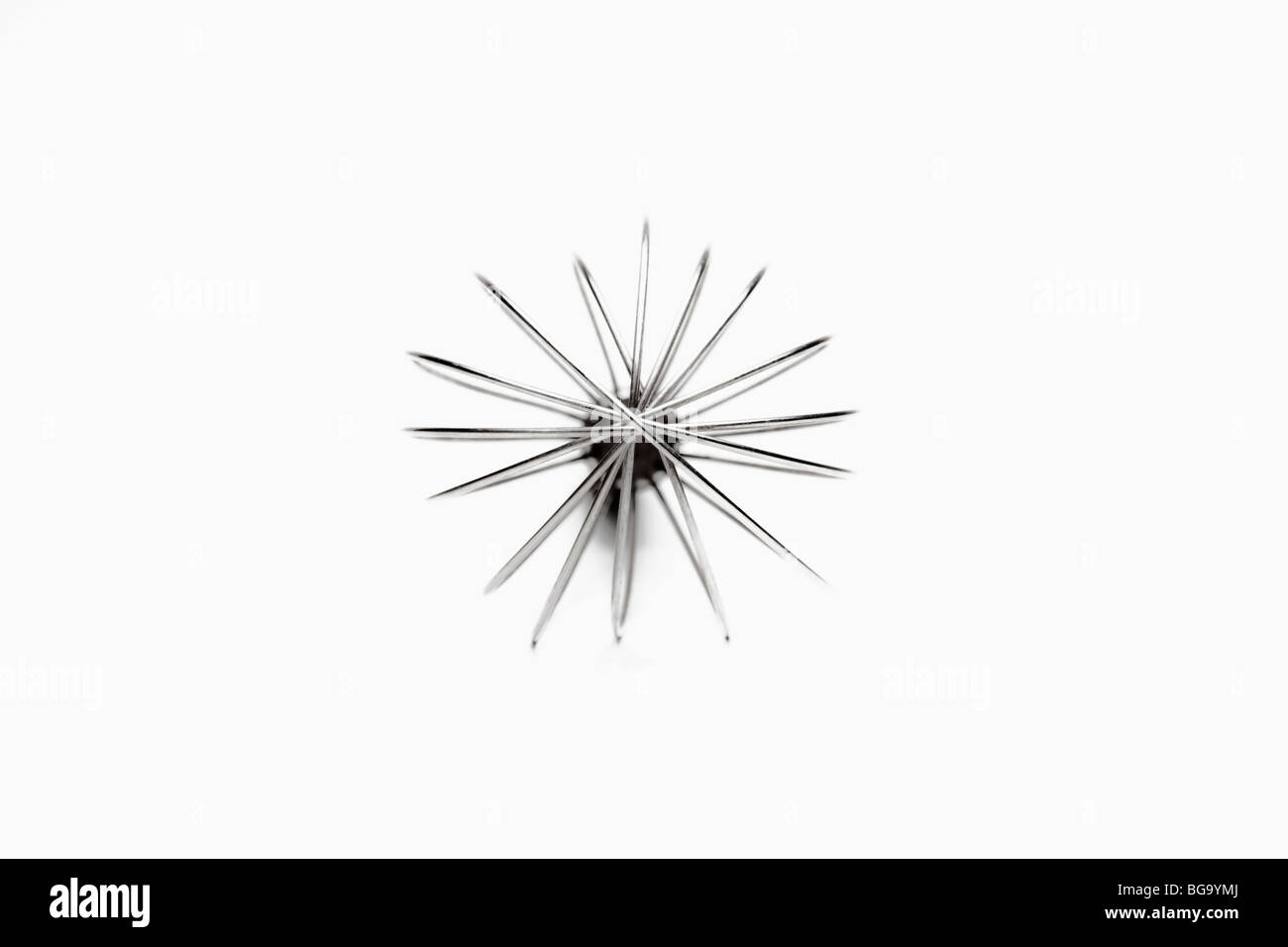 frontal closeup of silver whisk isolated on white background Stock Photo
