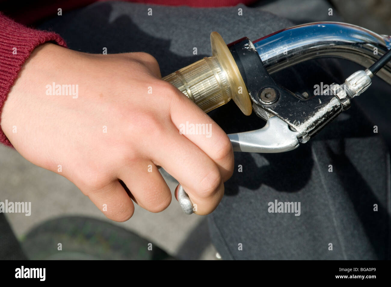 front brake lever levers brakes hand handle bars rider riding bmx bike bikes cycle cycles finger on fingers cable handgrips hand Stock Photo