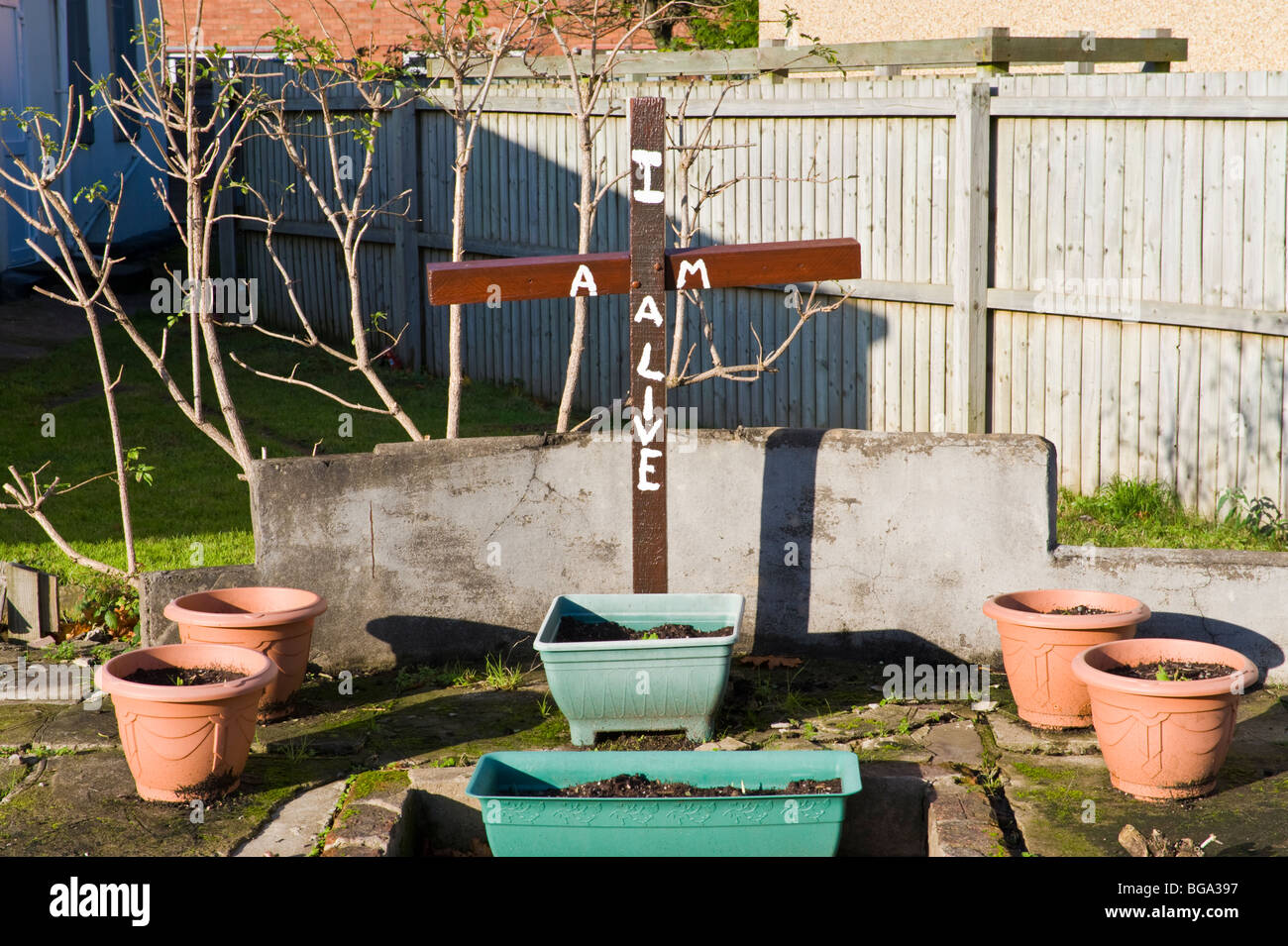 Wooden cross in garden at Corporation Road Baptist Church in Newport South Wales UK Stock Photo