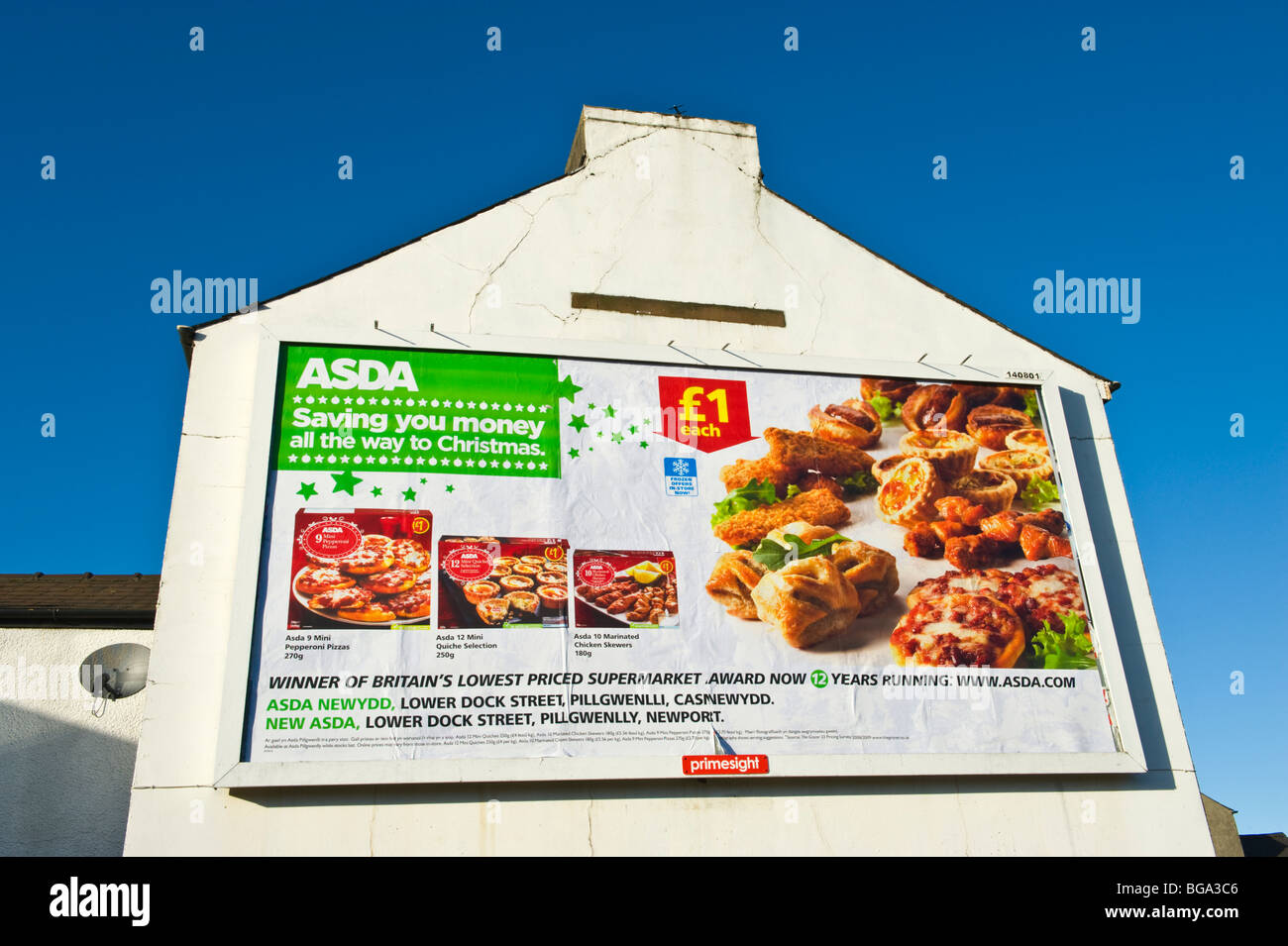 primesight billboard site on end of house wall featuring ASDA food poster in Newport South Wales UK Stock Photo