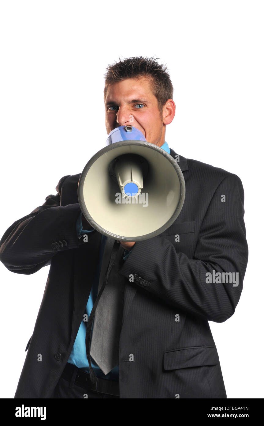 Young businessman with megaphone expressing anger isolated on a white background Stock Photo