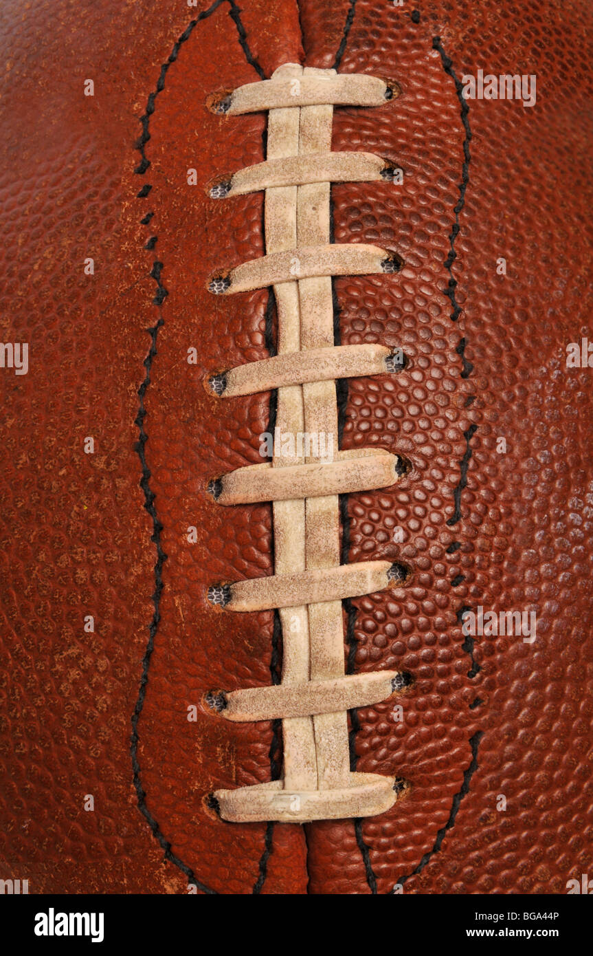 Oldf football close up showing the laces on a vertical format Stock Photo