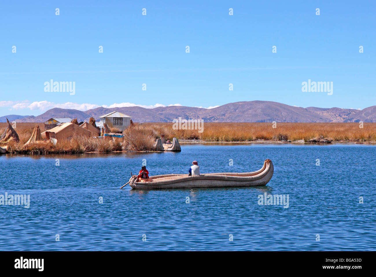 reed boat in front of floating Uro Island, Lake Titicaca, Puno, Peru ...