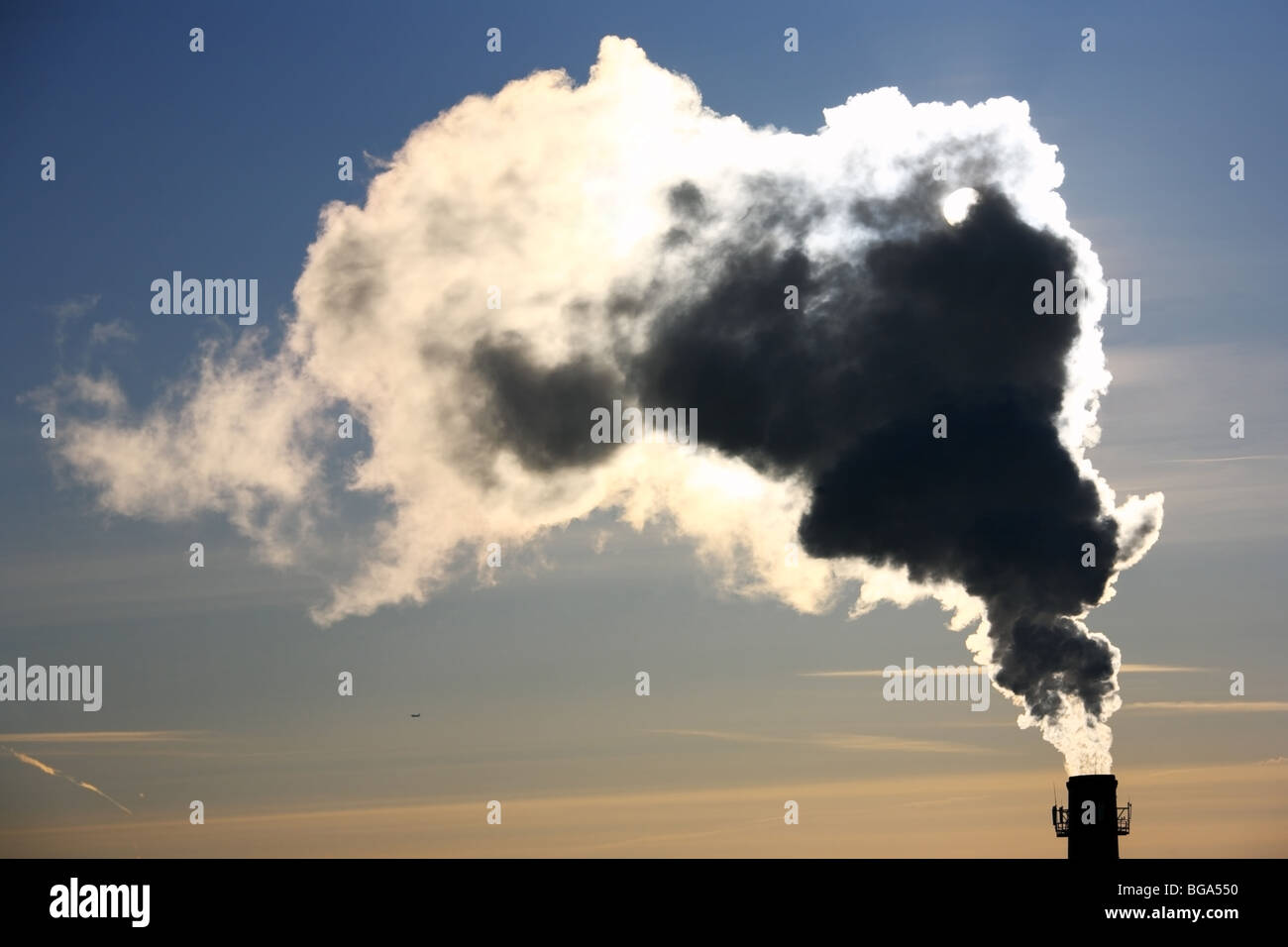 Pollution. Thick smoke from the chimney in winter morning. Stock Photo
