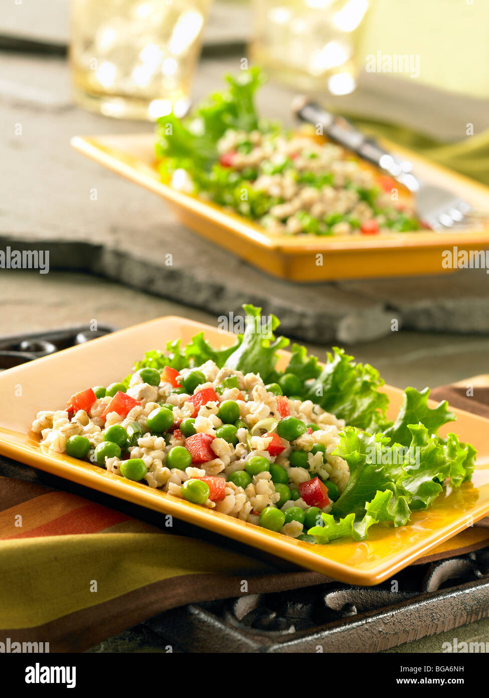 Barley green pea and red pepper salad Stock Photo