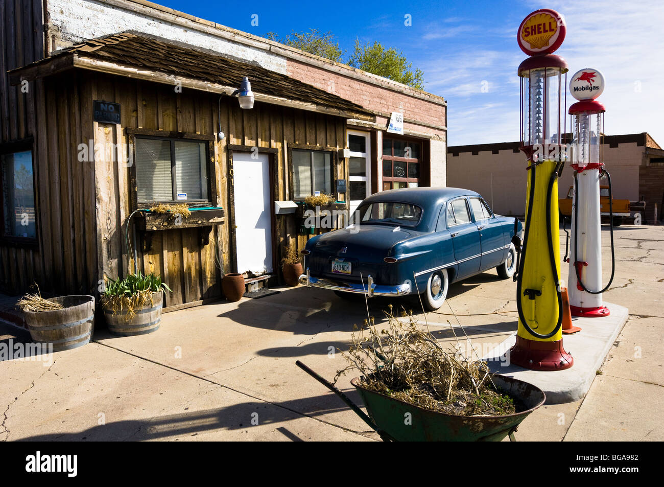 Gas station displaying a classic 1950 Ford and vintage gas pumps in Williams, Arizona, on historic Route 66. Stock Photo