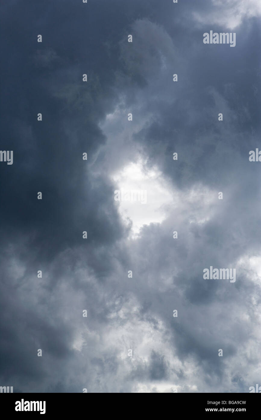 Swirling storm clouds with an opening in the middle. Stock Photo