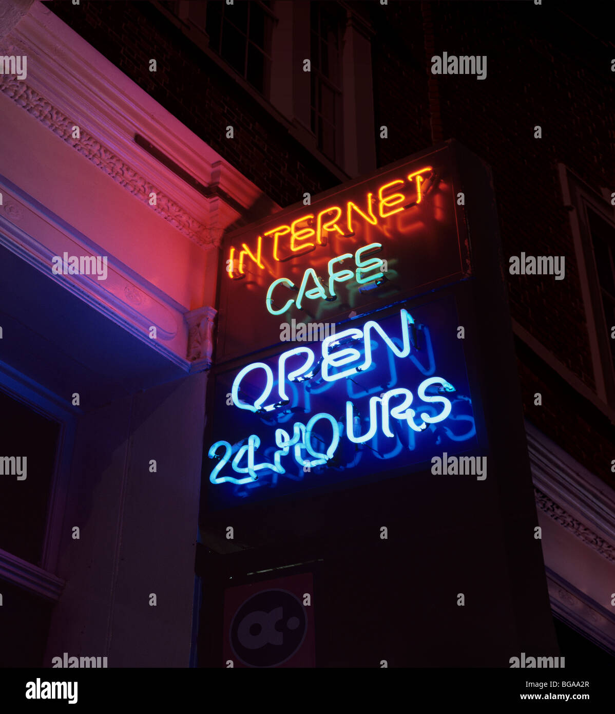 Sign advertising a 24 hour internet cafe. Stock Photo