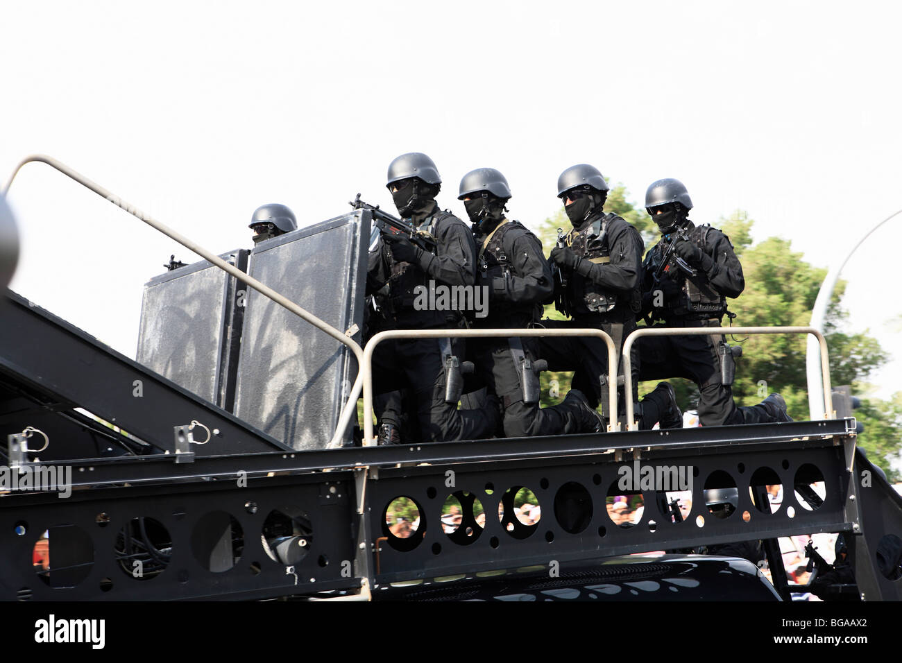 Black-clad security forces, ready for action, taking part in a military parade to mark Qatar National Day, December 18, 2009 Stock Photo