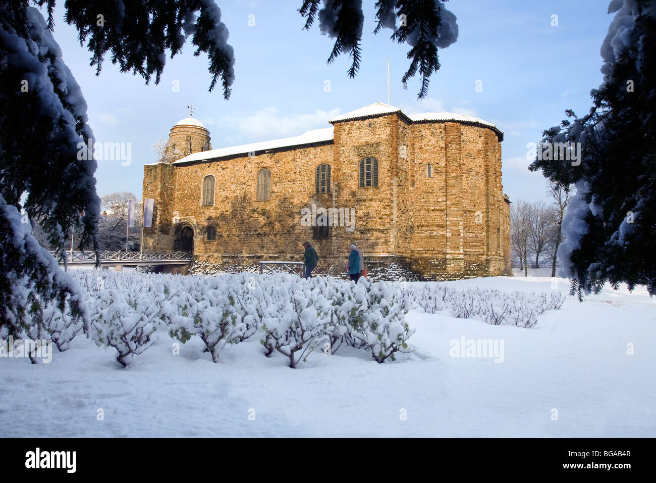 SNOW SCENE IN COLCHESTER CASTLE PARK WITH THE CASTLE BATHED IN SUNLIGHT