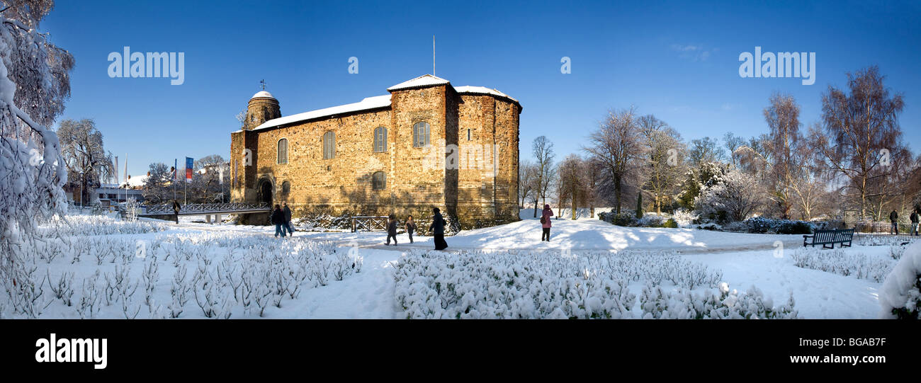 SNOW SCENE IN COLCHESTER CASTLE PARK WITH THE CASTLE BATHED IN SUNLIGHT