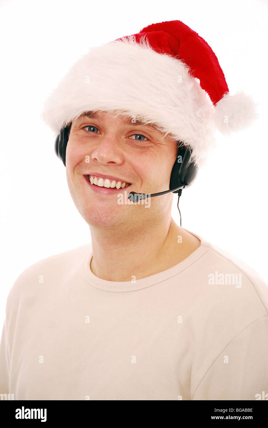 Young man wearing a Santa hat working in an Office Stock Photo - Alamy