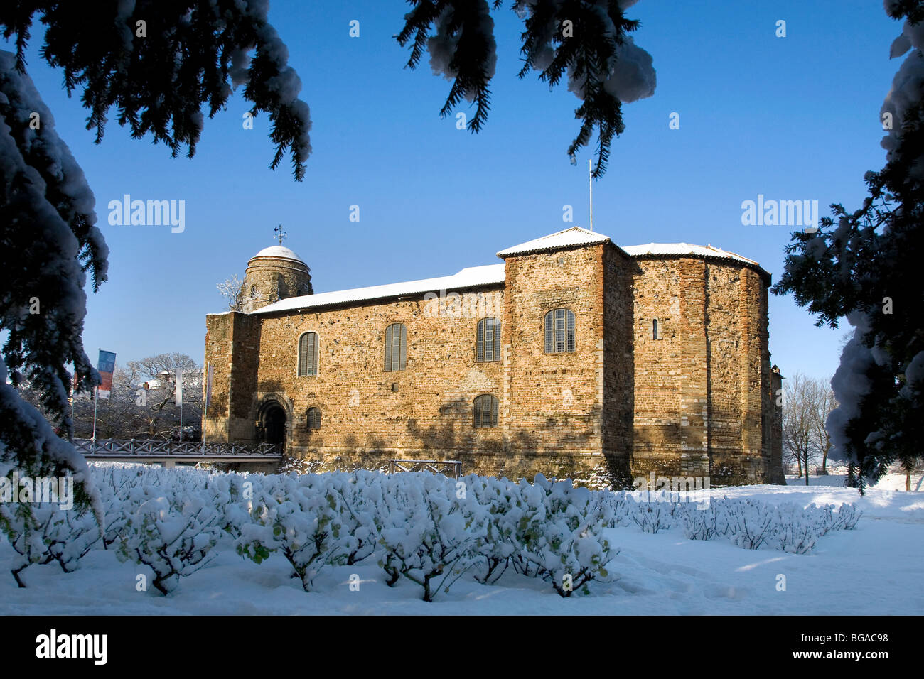 SNOW SCENE IN COLCHESTER CASTLE PARK WITH THE CASTLE BATHED IN SUNLIGHT