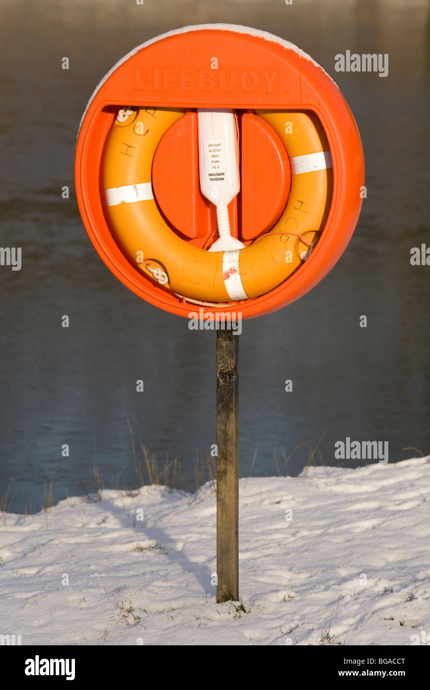 A high visibility lifebuoy is coloured orange. Stock Photo