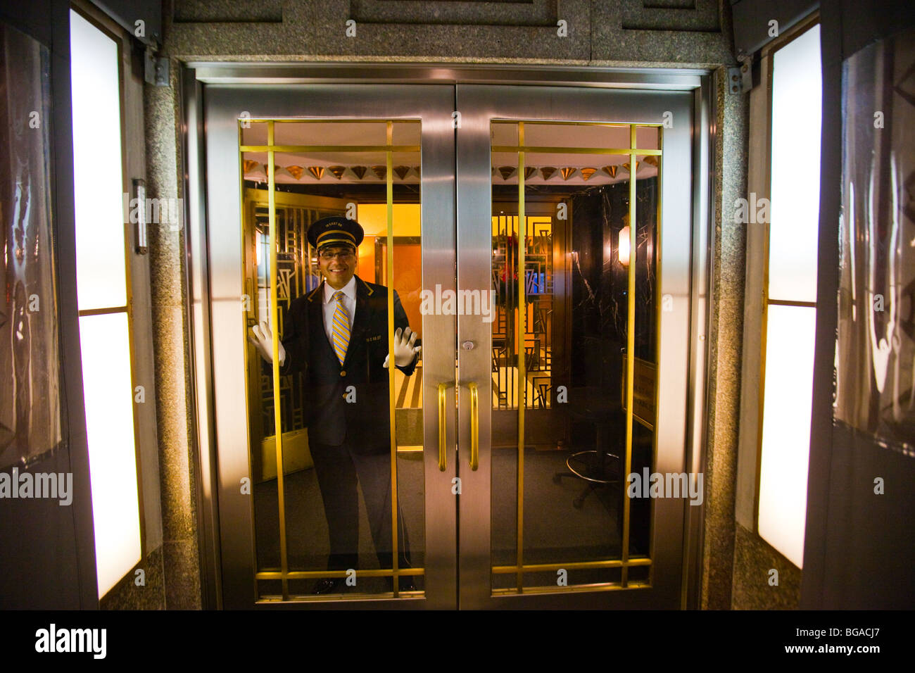 Doorman in the entrance of an Upper East Side apartment building in Manhattan, New York Stock Photo