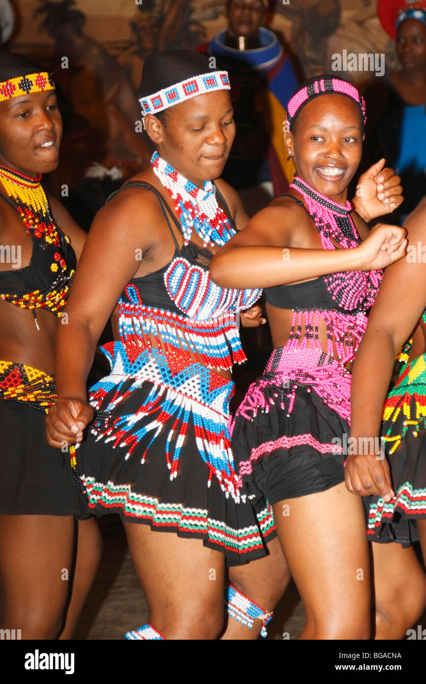 Young zulu girls happily dancing in her traditional beady dress. Close up shoot.  Lesedi Village, South Africa, November, 2009 Stock Photo