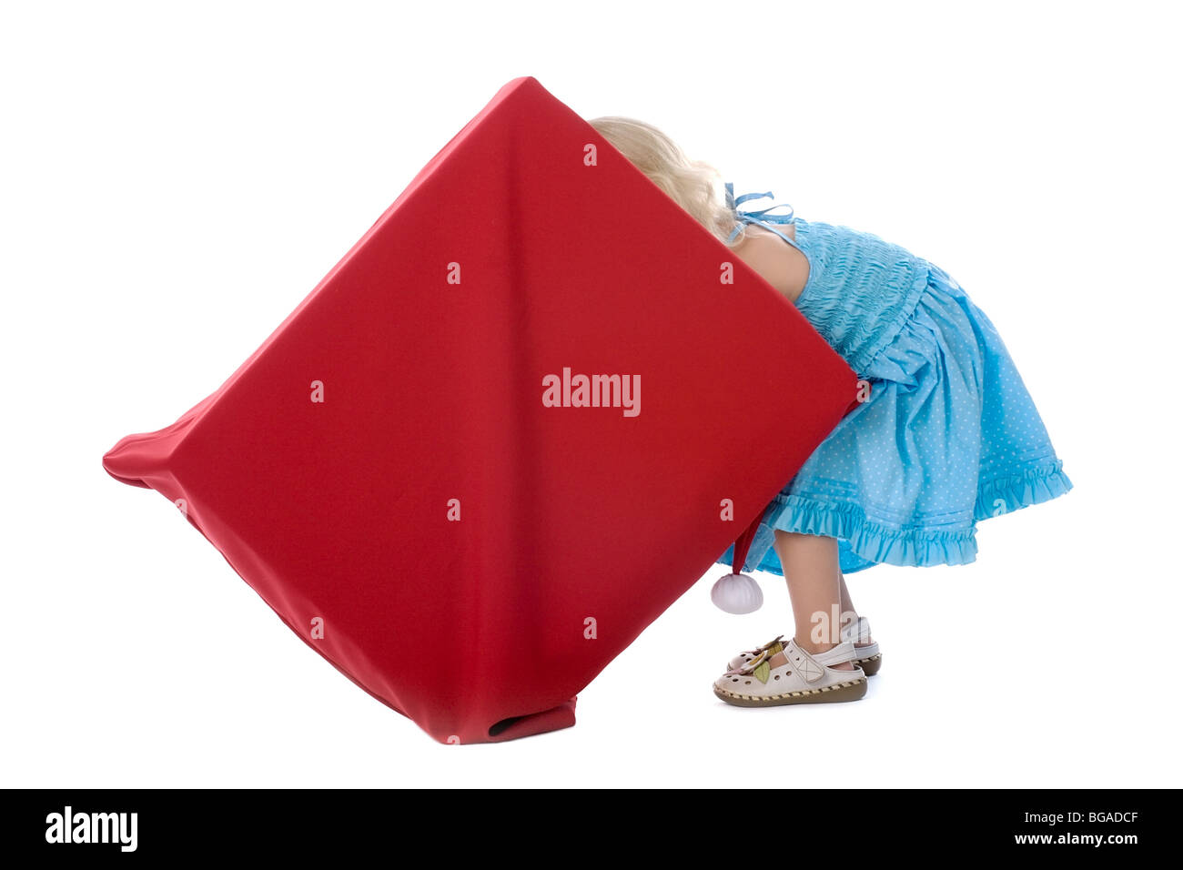 the little girl gets gifts from the big red box Stock Photo - Alamy