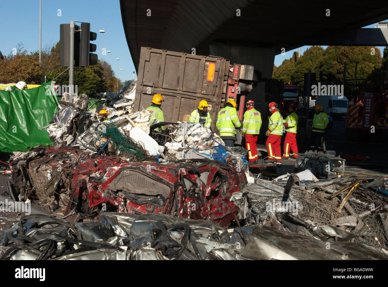 Crashed overturned lorry containing crushed cars Stock Photo