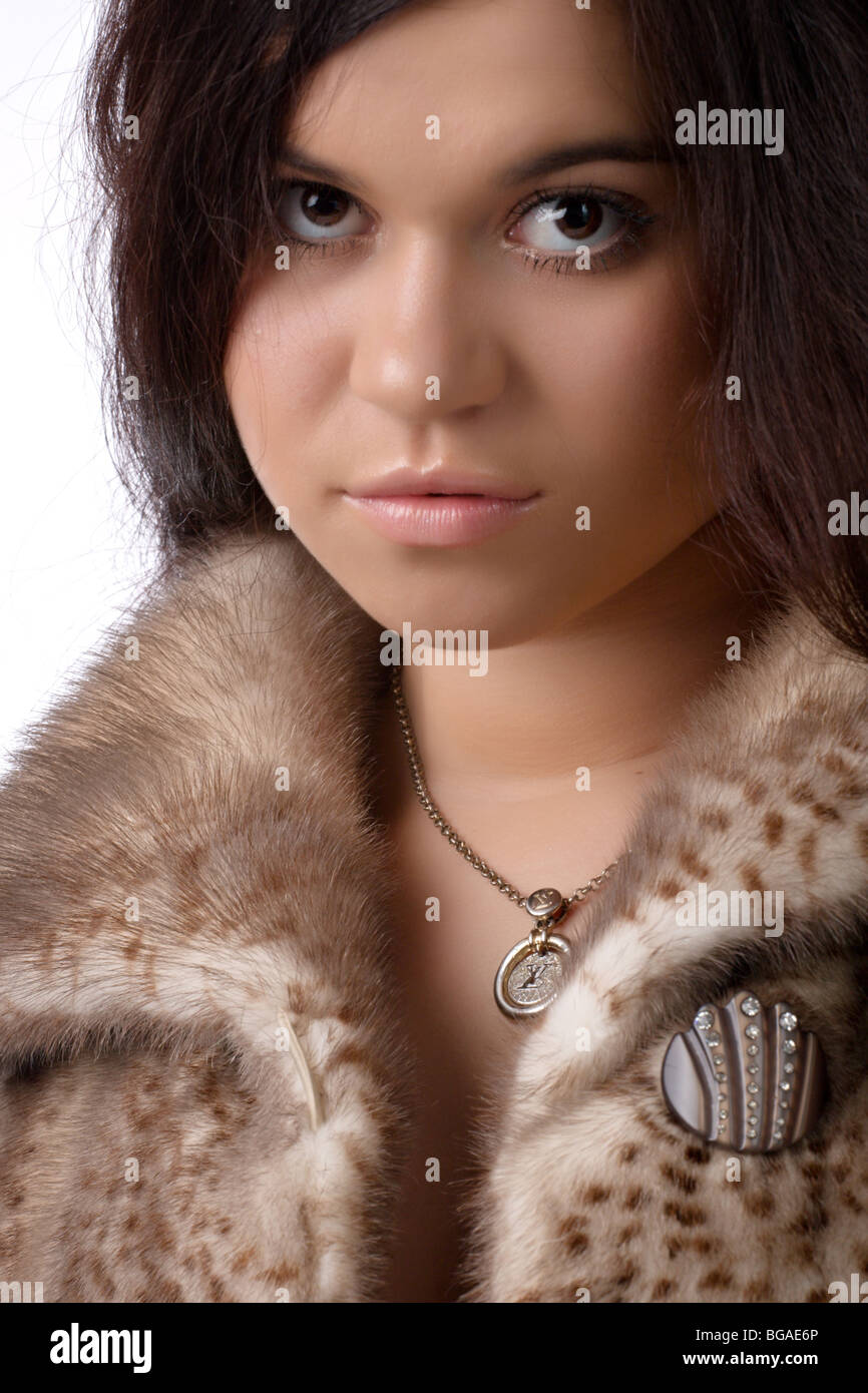 close-up portrait of a beautiful young woman in fur coat Stock Photo ...