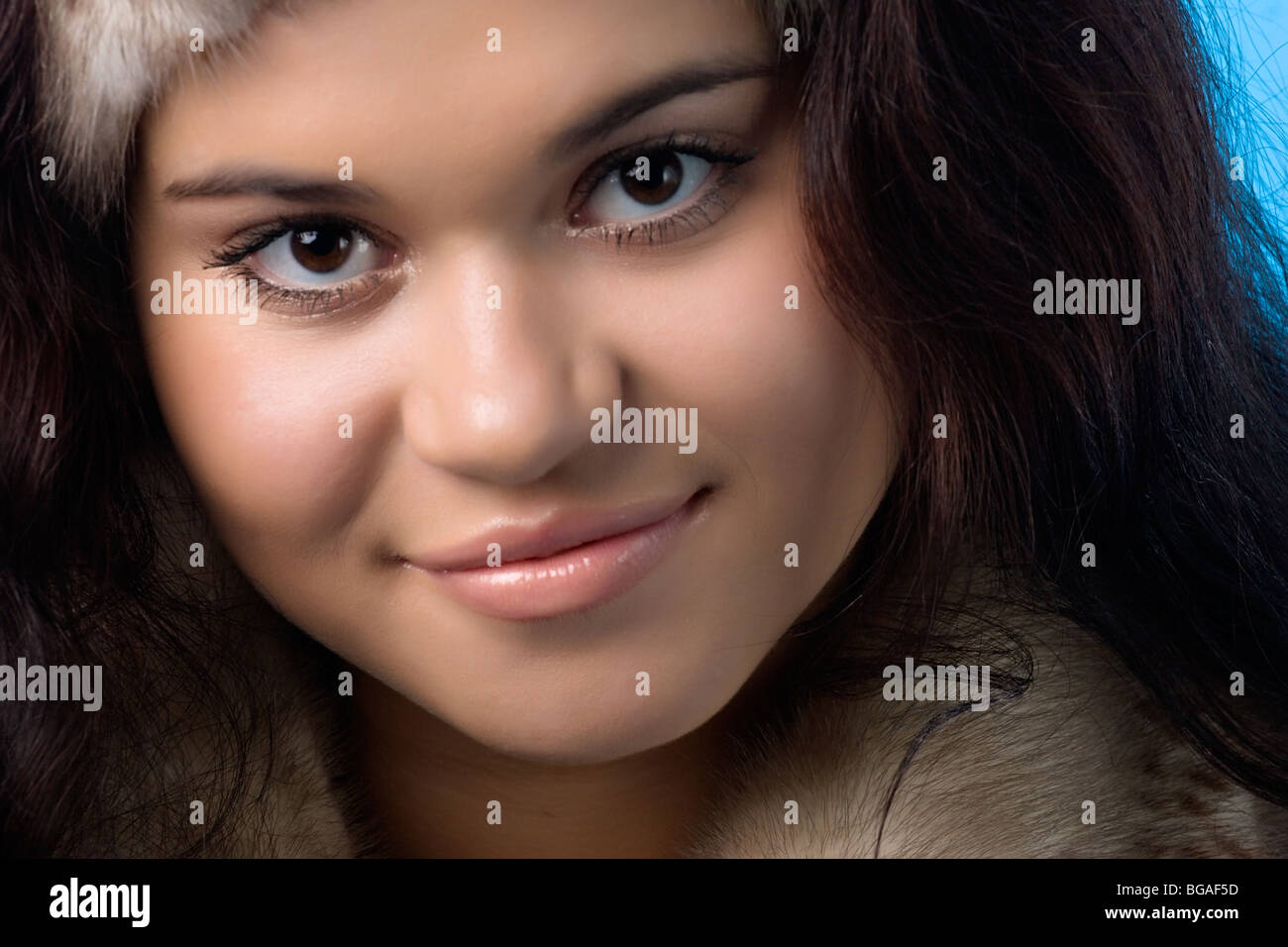close-up portrait of a beautiful young woman in fur coat Stock Photo ...