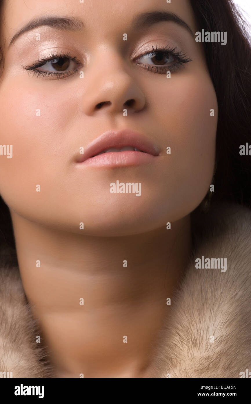 close-up portrait of a beautiful young woman in fur coat Stock Photo ...